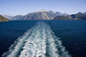 Images Dated 4th July 2009: Norway, Geirangerfjord (UNESCO), Geiranger. Picturesque summer fjord view with ship wake