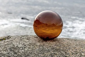 Nordland Prints: Norway, Lofoten Islands, Vareid. Mountains and ocean viewed through a glass ball