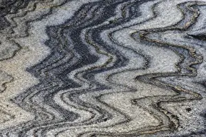 Norway, Nordland. Folds and intrusions forming intricate patterns in a rock formation