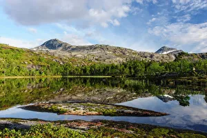 Norway, Nordland. Mountain scenery. Evening light at Gurtejavre lake