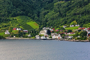 Steeple Prints: Norway, Norwegian Fjords. Seaside village, church, red barns