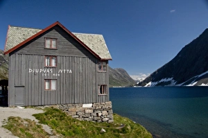 Norway. Scenic byway 63 between Geiranger & Hellesylt. Djupvasshytta Mountain Lodge and lake