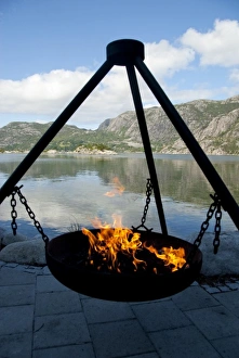Images Dated 21st June 2009: Norway, Stavanger, Lysefjord (aka Lyse Fjord). Warming fire at coastal resort along