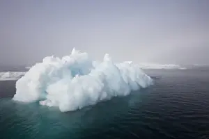 Silence Prints: Norway, Svalbard, Iceberg floating in still sea in Storfjorden Fjord in Tusenoyane