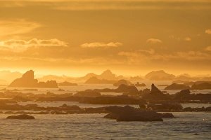 Norway Collection: Norway, Svalbard, Nordaustlandet. Silhouette of icebergs backlit at sunset. Credit as
