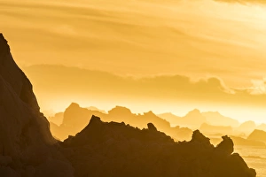 Norway Collection: Norway, Svalbard, Nordaustlandet. Silhouette of icebergs backlit at sunset. Credit as