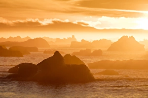 Norway Collection: Norway, Svalbard, Nordaustlandet. Silhouette of icebergs backlit at sunset. Credit as