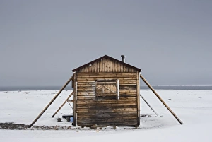 Images Dated 7th August 2008: Norway, Svalbard, Nordaustlandet, Wooden trappers hut in storm during summer
