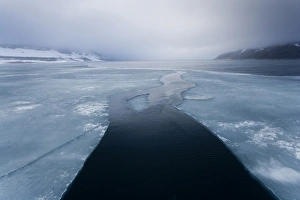 Images Dated 5th August 2009: Norway, Svalbard, Nordaustlandet, Lead through melting sea ice in fog near Scoresby