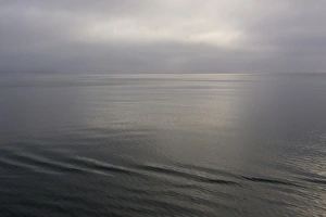 Images Dated 22nd June 2014: Norway. Svalbard. Nordaustlandet Island. Calm water and cloudy skies