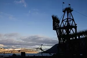 Images Dated 14th August 2008: Norway, Svalbard, Pyramiden, Silhouette of loading crane along waterfront at abandoned