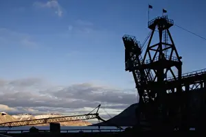 Mine Prints: Norway, Svalbard, Pyramiden, Silhouette of loading crane along waterfront at abandoned