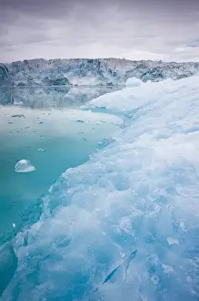 Krossfjorden Prints: Norway, Svalbard, Spitsbergen, Blue iceberg floating near face of Lilliehook Glacier