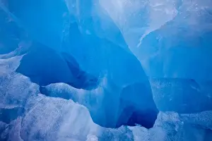 Images Dated 12th August 2008: Norway, Svalbard, Spitsbergen, Deep blue iceberg floating near face of Lilliehook