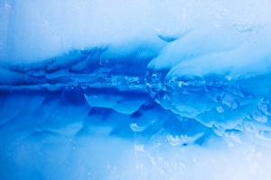 Norway, Svalbard, Spitsbergen Island, Close-up image of patterns in deep blue glacial