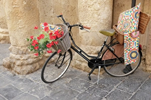 Sicily Prints: Noto, Sicily. Bike displays goods outside of a shop