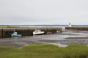 Nova Scotia, Canada. Fishing boats at low tide in Gilberts Cove