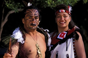 Oceania, New Zealand, North Island. Maori culture, man and woman warriors in native Maori costume