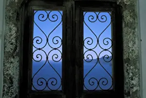 Curl Prints: Oia, Santorini, Greece, Looking through an ornate iron window to the Aegean Sea