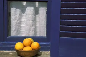 Curtain Prints: Oia, Santorini, Greece, Oranges in a basket on a windowsill in the sun