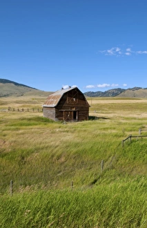 Images Dated 2028: Old barn and field in remote Butte Montana