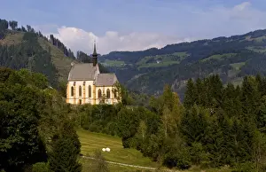 Austrian Prints: Old historical old church called Parish Church of Murau Austria and mountains