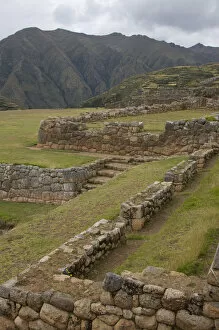 Old Inca walls surround field with mountain in distance, Chinchero (near Cuzco), Peru