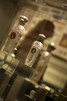 Perfume Prints: Old perfume bottles display in Musee du Parfum. Paris. France