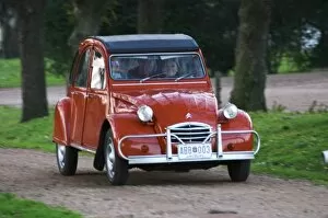 Images Dated 18th August 2005: An old red Citroen 2CV car with a smiling woman driving, Elisa Trabal de Bouza owner