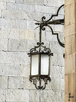 Gothic Prints: Old street lamp hanging in the streets of Santiago de Compostela