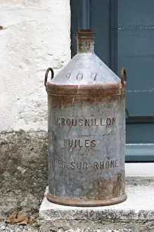 An old tin jar for transporting olive oil Crousnillon Huiles. Moulin Mas des Barres olive mill