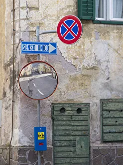 Dolomite Prints: Old town house and traffic signs. Predazzo in valley Val di Fiemme