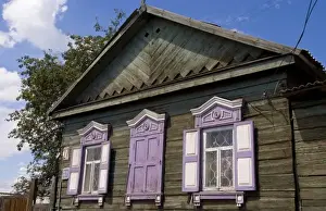 Old wooden worn house with colorful shutters in Irkutsk in Siberia Russia