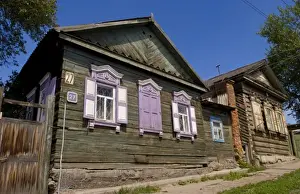 Electrical Prints: Old wooden worn house with colorful shutters in Irkutsk in Siberia Russia