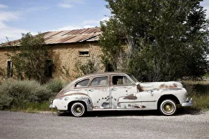 Nostalgia Prints: Old worn classic car parked on the side of the road, New Mexico, Route 66