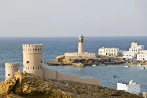 Images Dated 22nd February 2007: Oman, Sharqiya Region, Sur. Towers of Al Ayajh Fort / Sur Bay / Late Afternoon