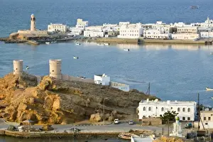 Images Dated 22nd February 2007: Oman, Sharqiya Region, Sur. Towers of Al Ayajh Fort / Sur Bay / Late Afternoon