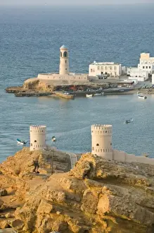 Images Dated 22nd February 2007: Oman, Sharqiya Region, Sur. Towers of Al Ayajh Fort / Sur Bay / Late Afternoon