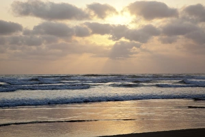 OR, Cannon Beach, ocean waves at sunset
