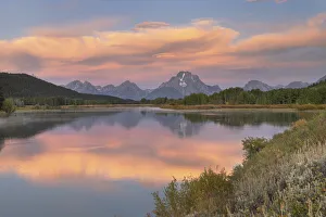 Still Prints: Orange clouds and Mount Moran reflected in still waters of the Snake River at Oxbow Bend at sunrise