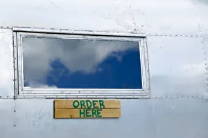 Silver Prints: Order here sign on a vintage trailer, Phoenicia, New York, USA