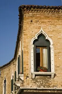 Ornate window of a house on Murano Island, Venice, Italy