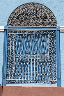 Prints of Ornate wrought iron covering on blue wooden window shutters, Trinidad, Cuba Caribbean Prints: Ornate wrought iron covering on blue wooden window shutters, Trinidad, Cuba