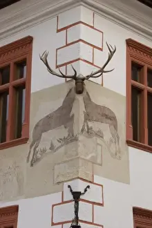 Corner Prints: Painting and curving of an Elk in the old medieval city os Sighisoara