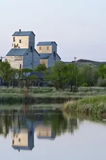 Granary Prints: Pair of grain elevators reflect into pond at Sentinel Butte North Dakota