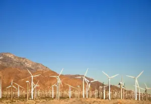 Turbine Prints: Palm Springs, CA, USA - Wind turbine farm in the desert under a clear blue sky. Horizontal