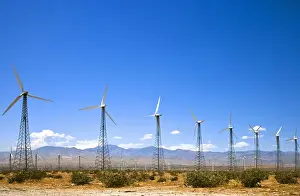 Turbine Prints: Palm Springs, CA, USA - Wind turbines in a desert landscape with rocky hills in the background