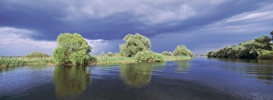 Panorama of lakes and channels in the Danube Delta, romania, thunderstorm clouds form in the air