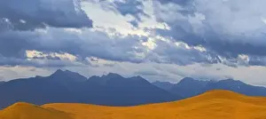 Moiese Prints: Panoramic view of a stormy evening over the Mission Mountains from the National Bison