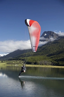 Images Dated 21st December 2007: Paramotor skimming water, Diamond Lake, Paradise, near Glenorchy, Queenstown Region